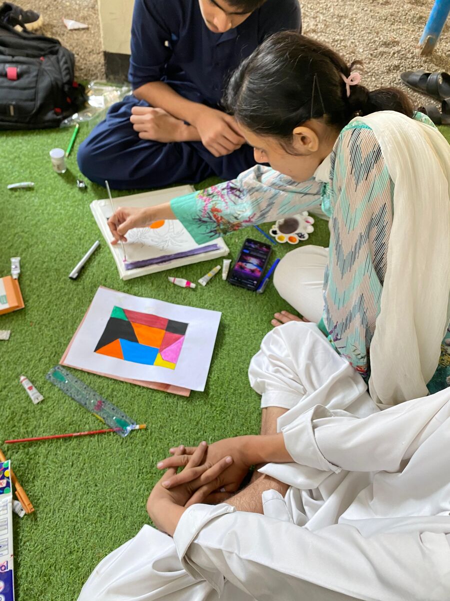 Pupils drawing and painting together on Art Day